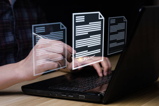 businessman uses a pen to sign electronic documents on digit