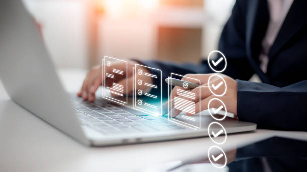 women touching a virtual screen to tick mark documents for o