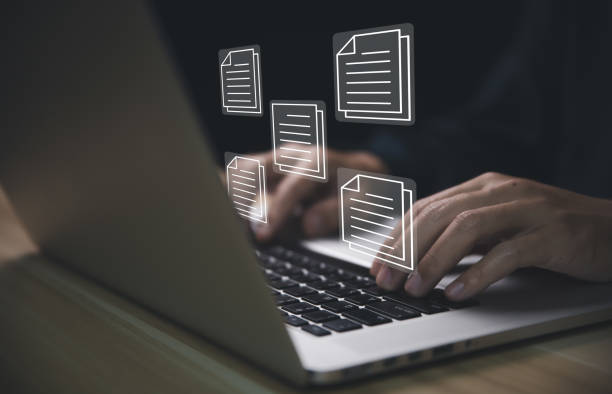 working man submitting work on laptop electronic document management
