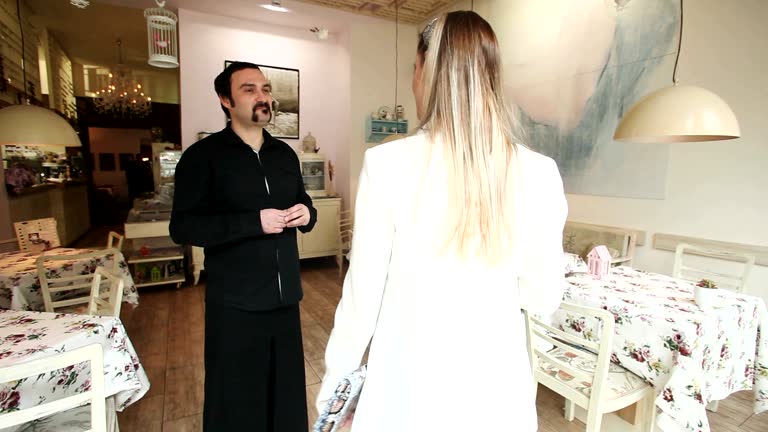 Beautiful young woman walking into a restaurant