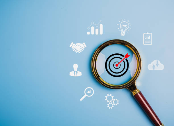 magnifier glass focus to target dartboard business development strategy and action plan1445112461