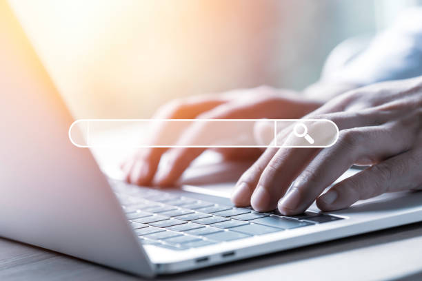 searching browsing data information network concept businessman using laptop computer to1264839512
